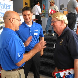 Image of two LB Water employees interacting with a customer