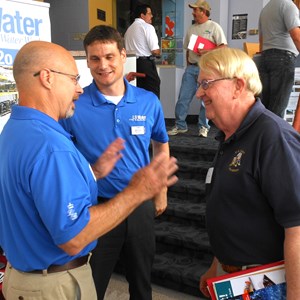 Image of two LB Water employees interacting with a customer Image of two LB Water employees interacting with a customer