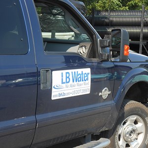 Close-up of passenger door displaying LB water logo on truck Close-up of passenger door displaying LB water logo on truck